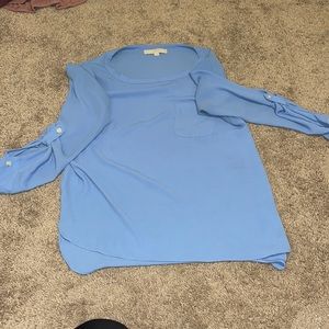 Periwinkle blue blouse.